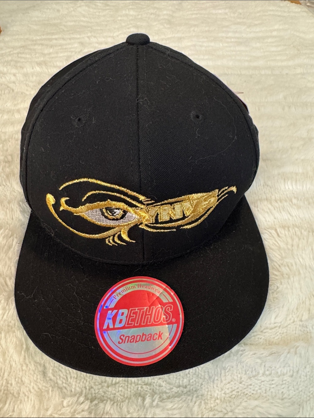 KBETHOS Black and Gold Embroidered Snapback Hat